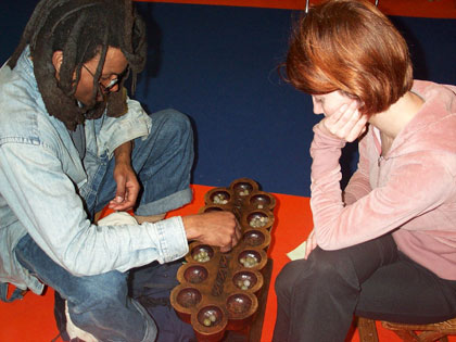 Lasana Richards playing Virginie Catala