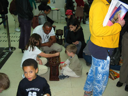 Oliver Oguntunde teaching Oware at the British Museum