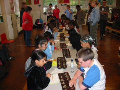 Parents & Teachers looking on as the players battle it out