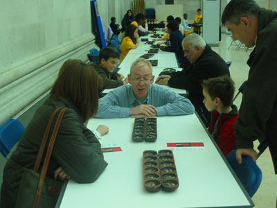 Richard Woff showing members of the public how to play.