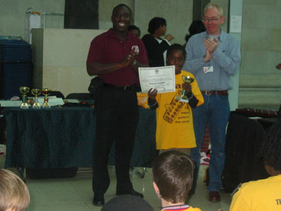 Selei Smalling winner of competition receiving her prize & certificate.