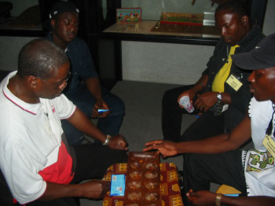 Francis playing Yao with Trevor & Wayne looking on.